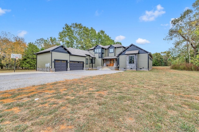 view of front facade featuring a garage and a front lawn