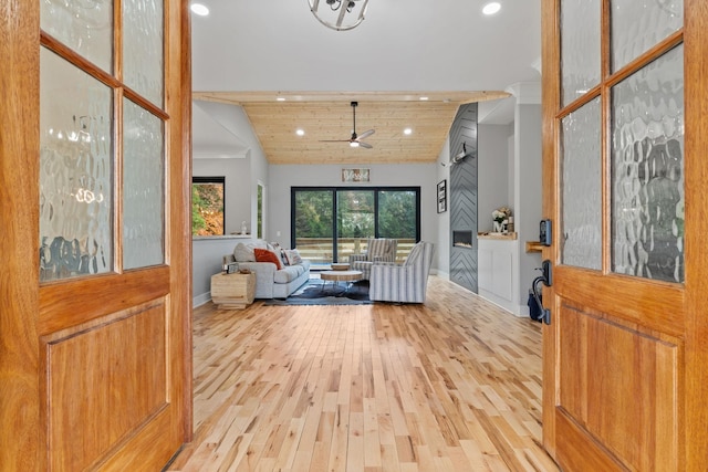 foyer with ceiling fan, wood ceiling, lofted ceiling, and hardwood / wood-style flooring