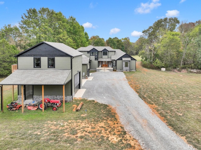 view of front facade with a garage and a front lawn