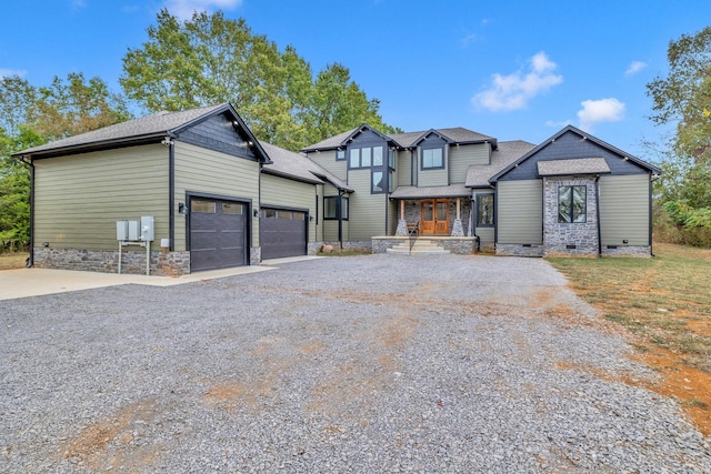 view of front of house featuring a porch and a garage