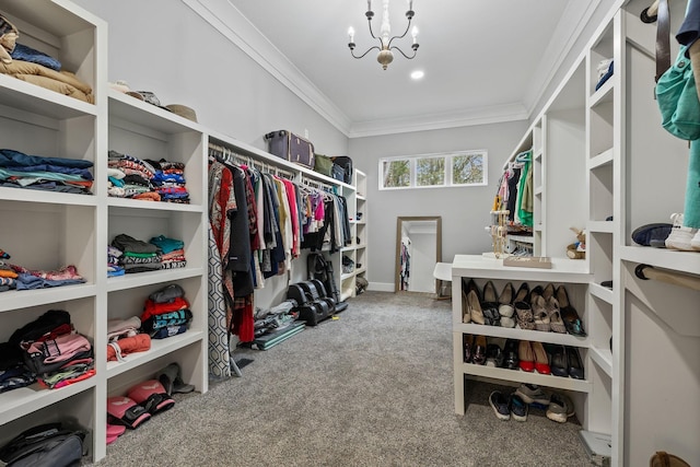 spacious closet with carpet floors and a notable chandelier