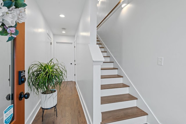 stairway featuring hardwood / wood-style flooring