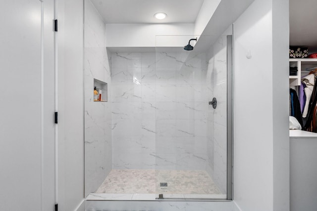 bathroom with a tile shower