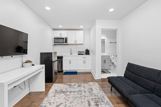 living room with dark wood-type flooring