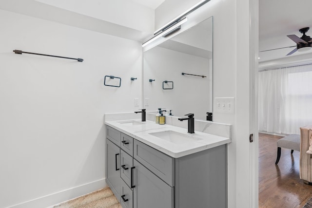 bathroom featuring ceiling fan and vanity