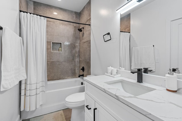 full bathroom featuring wood-type flooring, shower / bath combination with curtain, vanity, and toilet