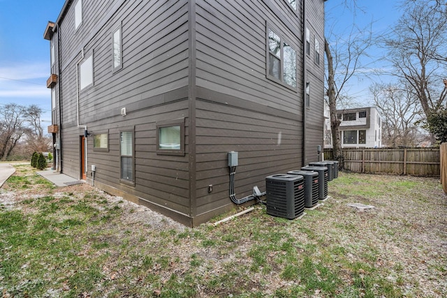 view of side of property featuring central AC unit