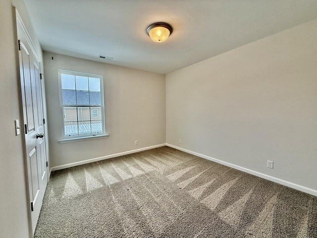 spare room featuring carpet floors