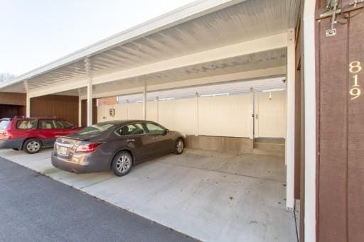 view of parking featuring a carport