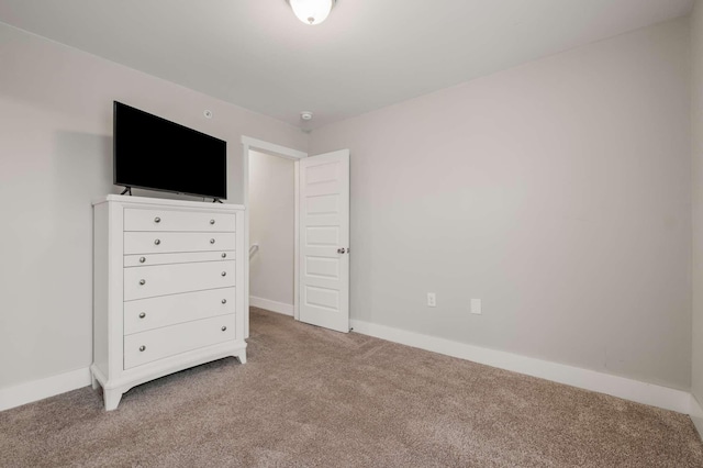 unfurnished bedroom featuring carpet