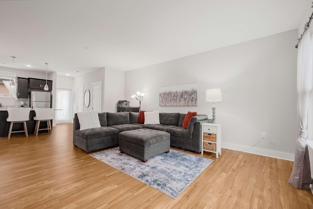 living room with light hardwood / wood-style floors