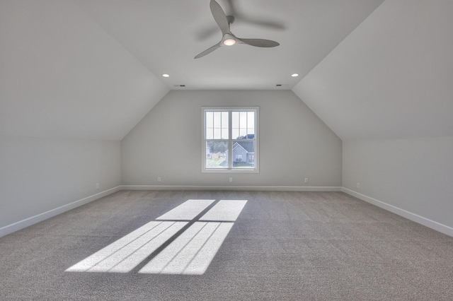 bonus room with ceiling fan, light colored carpet, and vaulted ceiling