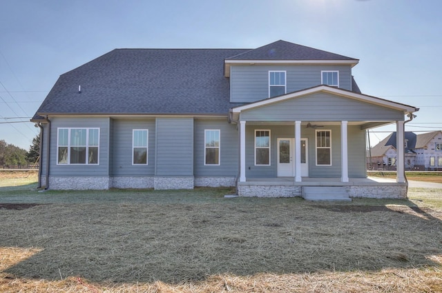 view of front of home featuring a porch and a front lawn