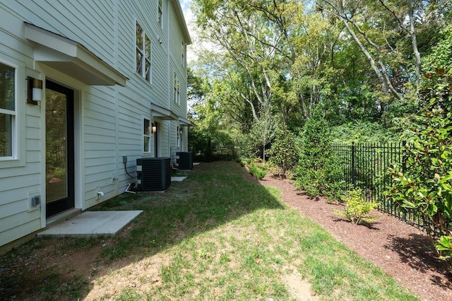 view of yard with central AC unit