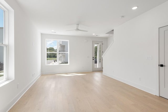 spare room featuring ceiling fan and light hardwood / wood-style floors