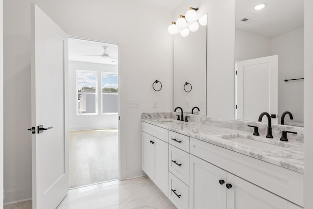 bathroom featuring ceiling fan and vanity