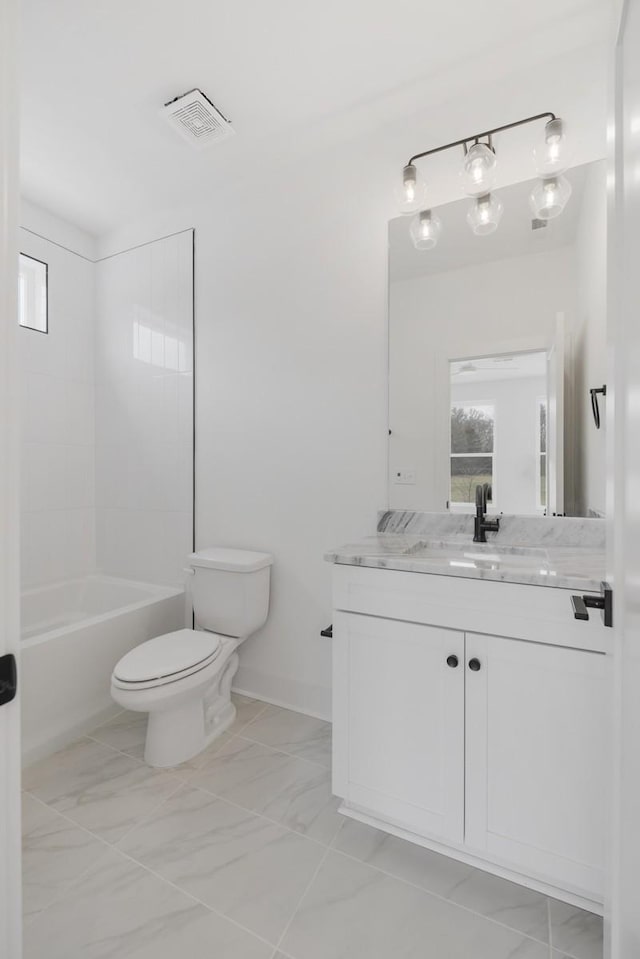 full bathroom featuring vanity, shower / bath combination, and toilet