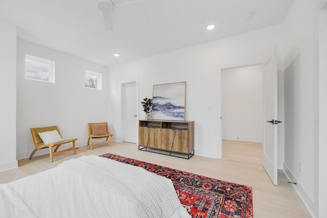 bedroom with ceiling fan and light hardwood / wood-style flooring