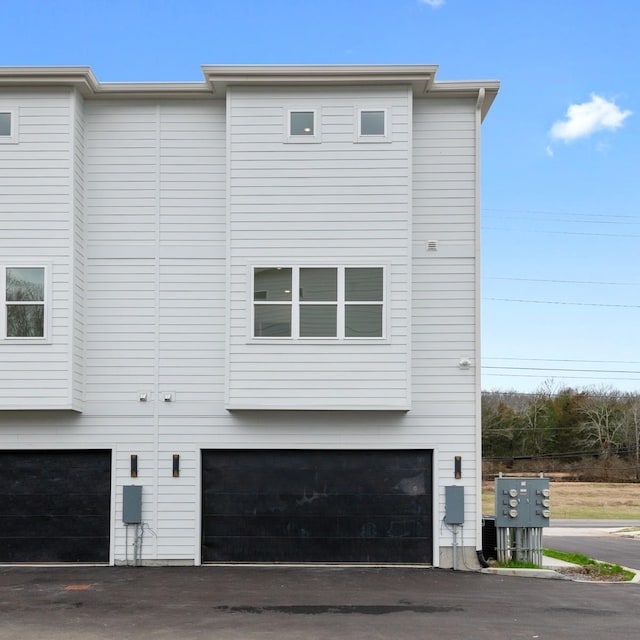 view of side of home with a garage