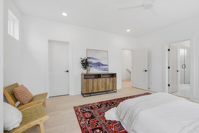 bedroom with light wood-type flooring and ceiling fan