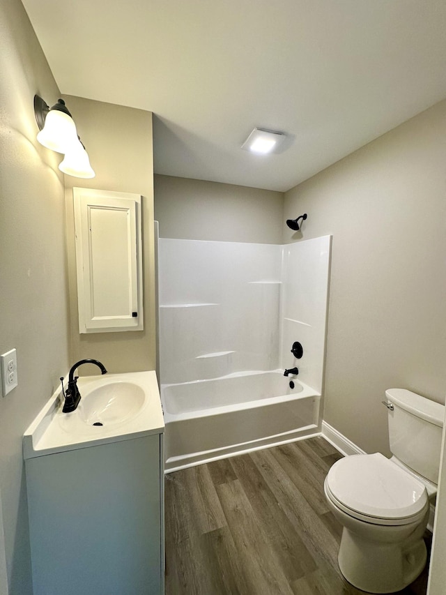 full bathroom featuring shower / washtub combination, toilet, vanity, and hardwood / wood-style flooring