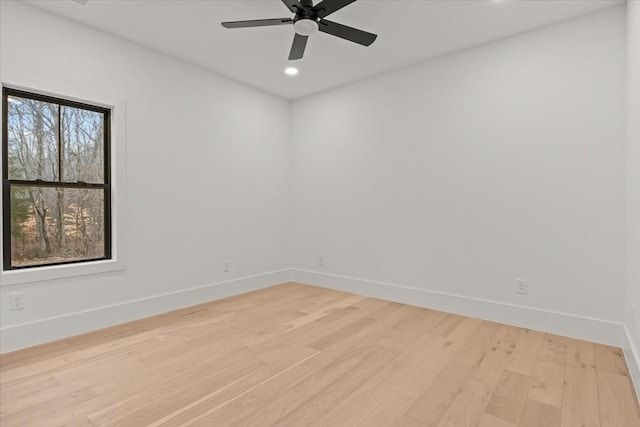 unfurnished room featuring ceiling fan and light hardwood / wood-style floors