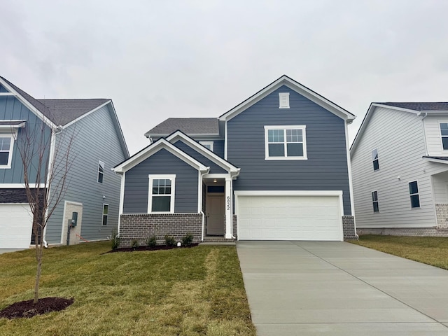 view of front facade with a garage and a front lawn