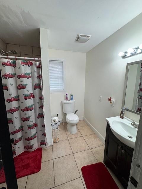 bathroom featuring curtained shower, tile patterned flooring, vanity, and toilet