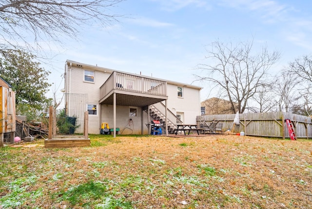 back of property with a wooden deck