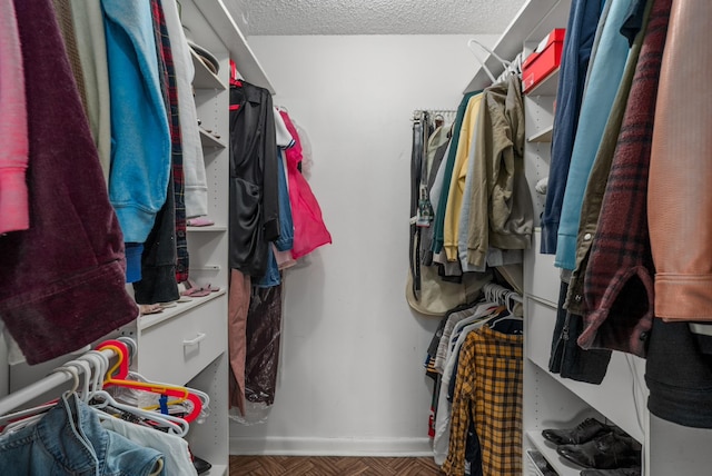 spacious closet with parquet floors