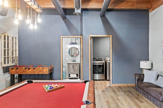 playroom with wood-type flooring, independent washer and dryer, and billiards