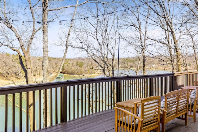 wooden deck with a water view