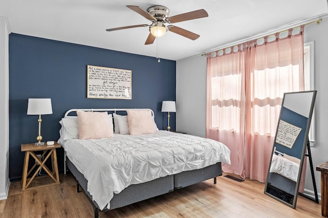 bedroom featuring ceiling fan and hardwood / wood-style floors