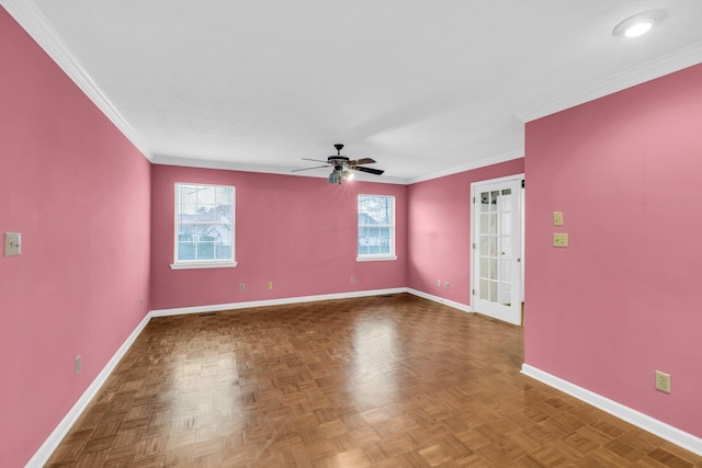 spare room featuring ceiling fan, crown molding, and parquet floors