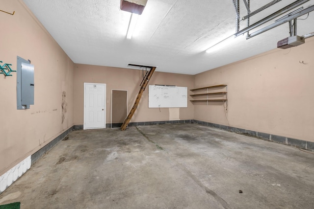 garage with electric panel and a garage door opener