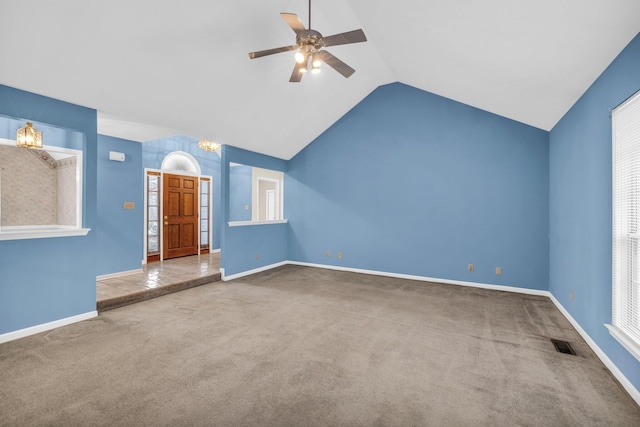 unfurnished living room featuring carpet, ceiling fan with notable chandelier, and lofted ceiling