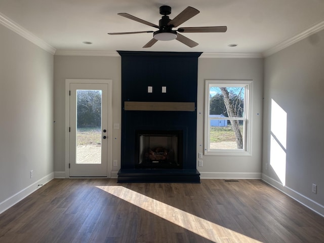 unfurnished living room with ceiling fan, ornamental molding, a fireplace, and dark wood-type flooring