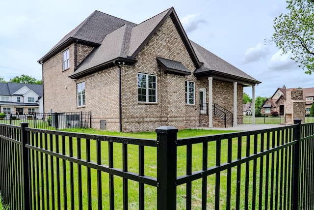 view of home's exterior with a lawn