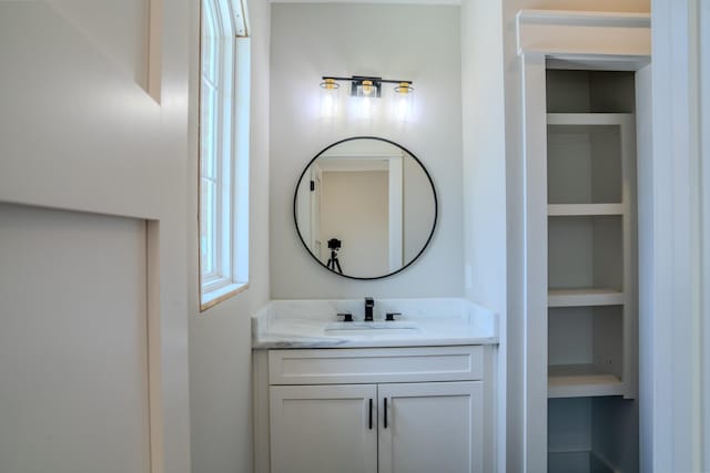 bathroom with vanity and built in features