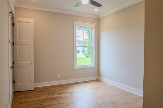 unfurnished room with ceiling fan, light hardwood / wood-style floors, and ornamental molding