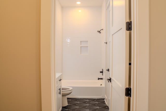 full bathroom featuring vanity, toilet, and tiled shower / bath