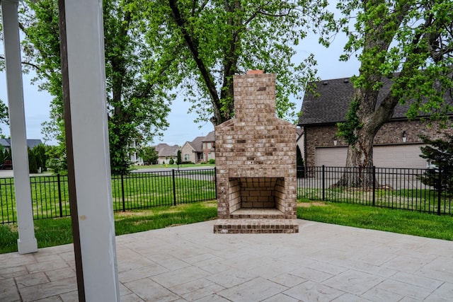 view of patio / terrace with an outdoor brick fireplace