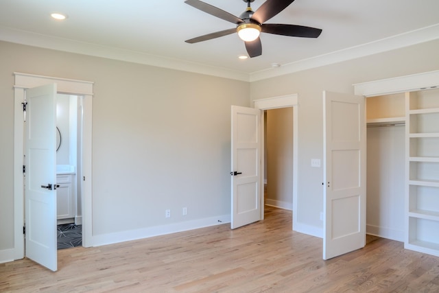 unfurnished bedroom featuring light wood-type flooring, a closet, ceiling fan, and crown molding