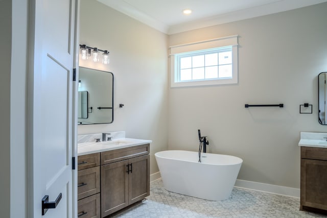 bathroom with a washtub, vanity, and ornamental molding