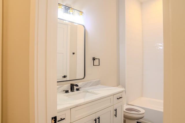 full bathroom featuring bathing tub / shower combination, vanity, and toilet