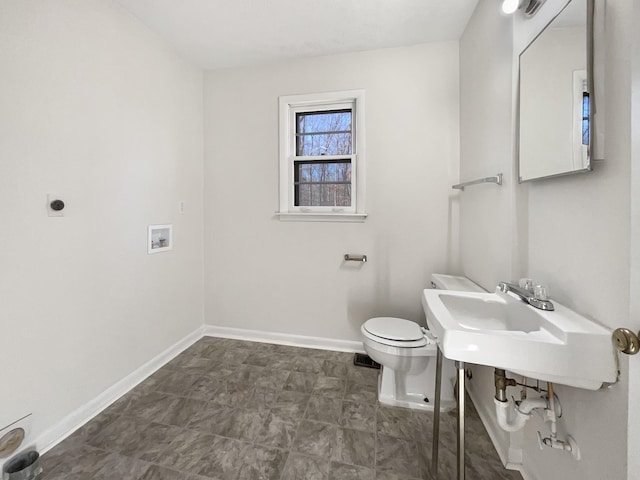 bathroom with toilet and sink