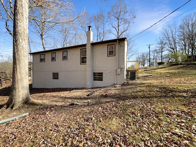 back of property featuring cooling unit