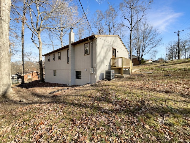 view of property exterior with central AC unit