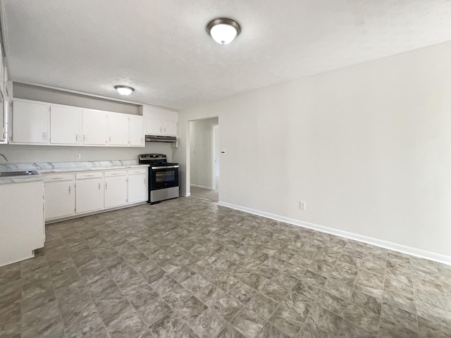 kitchen with white cabinets, a textured ceiling, stainless steel range with electric cooktop, and sink