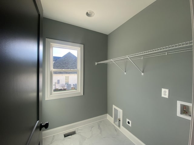 laundry area featuring hookup for an electric dryer and hookup for a washing machine